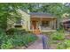 Charming single-story home with a landscaped front yard and a welcoming front porch, perfect for relaxing at 1405 Pennsylvania Ave, Durham, NC 27705