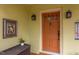 Close-up of the front door with stylish sconces, offering a warm welcome at 1405 Pennsylvania Ave, Durham, NC 27705