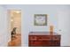 Hallway view to an office space with hardwood floors and natural lighting at 1405 Pennsylvania Ave, Durham, NC 27705
