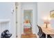 Hallway view into a bright bedroom with hardwood floors and modern decor at 1405 Pennsylvania Ave, Durham, NC 27705