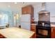 View of kitchen with breakfast nook and a dining area with abundant light at 1405 Pennsylvania Ave, Durham, NC 27705