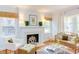 Inviting living room featuring a charming fireplace and large windows, creating a cozy atmosphere at 1405 Pennsylvania Ave, Durham, NC 27705