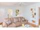 Comfortable living room with a plush sofa, built-in shelves, and cozy decor at 1405 Pennsylvania Ave, Durham, NC 27705