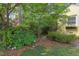 Landscaped yard featuring flowerbeds and a stone pathway to the house at 1405 Pennsylvania Ave, Durham, NC 27705