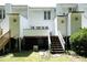 Exterior of home showcasing a backyard with a deck and ample green space at 146 Greenmont Ln, Cary, NC 27511