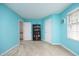 Bright bedroom with ample closet space, featuring a large window and neutral carpet at 146 Greenmont Ln, Cary, NC 27511