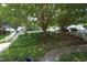 Lush greenery and mature trees enhance the street view, creating a serene atmosphere at 146 Greenmont Ln, Cary, NC 27511