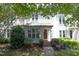 Charming two-story townhome with well-maintained landscaping and inviting front entrance at 146 Greenmont Ln, Cary, NC 27511