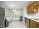 Bright kitchen area featuring stainless steel appliances and a cozy dining nook at 146 Greenmont Ln, Cary, NC 27511