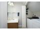 A laundry room features a washing machine and dryer, as well as a sink and storage space at 146 Greenmont Ln, Cary, NC 27511