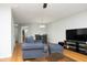 Bright living room featuring hardwood floors, a fireplace, and comfortable seating at 146 Greenmont Ln, Cary, NC 27511