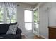 Living room features a door leading to the outside with a stylish gray and white patterned rug at 146 Greenmont Ln, Cary, NC 27511