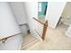 Carpeted staircase descends to the lower level with access to bathroom, and other rooms at 146 Greenmont Ln, Cary, NC 27511