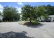 Scenic street view featuring mature trees, manicured landscaping, and well-maintained homes at 146 Greenmont Ln, Cary, NC 27511
