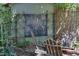 Tranquil backyard seating area with an inviting chalkboard sign and natural bamboo accents at 1613 Euclid Rd, Durham, NC 27713