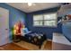 Bright, playful bedroom with hardwood floors and a sunny window at 1613 Euclid Rd, Durham, NC 27713