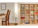 Stylish dining room with an open shelving unit displaying decorative dishware and kitchenware at 1613 Euclid Rd, Durham, NC 27713