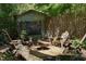 Tranquil fire pit area with chairs, perfect for outdoor entertaining at 1613 Euclid Rd, Durham, NC 27713