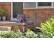 Charming home entrance featuring brick accents and well-manicured landscaping at 1613 Euclid Rd, Durham, NC 27713