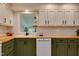 Charming kitchen featuring shaker cabinets, wood countertops, subway tile backsplash, and stainless steel appliances at 1613 Euclid Rd, Durham, NC 27713