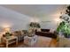 Bright and airy living room featuring hardwood floors and comfortable seating at 1613 Euclid Rd, Durham, NC 27713