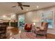Bright living room with hardwood floors, ceiling fan, and comfortable seating next to an updated kitchen at 1613 Euclid Rd, Durham, NC 27713