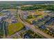 Aerial view of a Primary-planned community with homes, shops, and green spaces at 1624 Tunnel St, Wendell, NC 27591