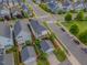 Birds-eye view of a two-story home with fenced yard and detached garage in a neatly planned neighborhood at 1624 Tunnel St, Wendell, NC 27591