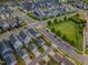 Overhead shot of a neighborhood showcasing a mix of home styles, tree-lined streets, and green spaces at 1624 Tunnel St, Wendell, NC 27591