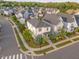 Aerial view of a charming two-story home with landscaped yard on a corner lot in a well-designed neighborhood at 1624 Tunnel St, Wendell, NC 27591
