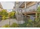 Outdoor area featuring a fenced-in yard, wooden stairs, and green foliage at 1624 Tunnel St, Wendell, NC 27591