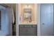 Bathroom with a gray vanity, dual lighting, and neutral walls, offering a clean and functional space at 1624 Tunnel St, Wendell, NC 27591