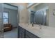 Bright bathroom with double sink vanity, modern faucets, and view to an adjacent living space at 1624 Tunnel St, Wendell, NC 27591