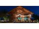A gathering space with string lights, tables, and chairs for outdoor dining and community events at 1624 Tunnel St, Wendell, NC 27591