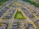 Aerial perspective of a community featuring a central park and a well-organized layout of residential streets at 1624 Tunnel St, Wendell, NC 27591