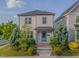 Inviting two-story home with a quaint front porch and manicured landscaping, creating a warm curb appeal at 1624 Tunnel St, Wendell, NC 27591