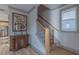 Hallway with hardwood floors and a staircase, creating a warm transition between spaces at 1624 Tunnel St, Wendell, NC 27591