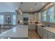 Bright kitchen with stainless steel appliances, granite countertops, and an island with barstool seating at 1624 Tunnel St, Wendell, NC 27591