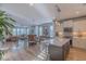 Open floor plan kitchen seamlessly connects to the living and dining areas with stainless appliances and hardwood floors at 1624 Tunnel St, Wendell, NC 27591