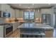 Stylish kitchen with stainless steel appliances, granite countertops, and a center island with seating at 1624 Tunnel St, Wendell, NC 27591