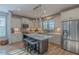 Bright kitchen with stainless steel appliances, ample cabinet space, and a center island with seating at 1624 Tunnel St, Wendell, NC 27591