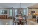Bright living space adjoining a dining area and featuring hardwood floors and a modern entertainment center at 1624 Tunnel St, Wendell, NC 27591