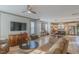 Open-concept living area with hardwood floors seamlessly connecting the living room to the kitchen at 1624 Tunnel St, Wendell, NC 27591