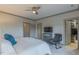 Main bedroom featuring soft carpet, a ceiling fan, and convenient access to the ensuite bathroom and walk-in closet at 1624 Tunnel St, Wendell, NC 27591