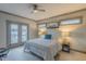 Main bedroom with plush carpet, ample natural light, and a private balcony, perfect for relaxation at 1624 Tunnel St, Wendell, NC 27591