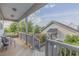Inviting porch with wooden deck, railings, seating, and green foliage at 1624 Tunnel St, Wendell, NC 27591