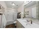 Bright bathroom featuring tub and shower, vanity, and decorative accents at 1625 Main Divide Dr, Wake Forest, NC 27587