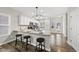 Bright open kitchen with stainless appliances, granite countertops, and ample white cabinetry at 1625 Main Divide Dr, Wake Forest, NC 27587