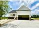Charming exterior view of a new home featuring a two-car garage and inviting front porch at 168 Clayton Rd, Princeton, NC 27569
