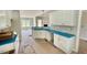 Stylish kitchen with white cabinetry, sleek countertops, and an open design leading to the living area at 168 Clayton Rd, Princeton, NC 27569